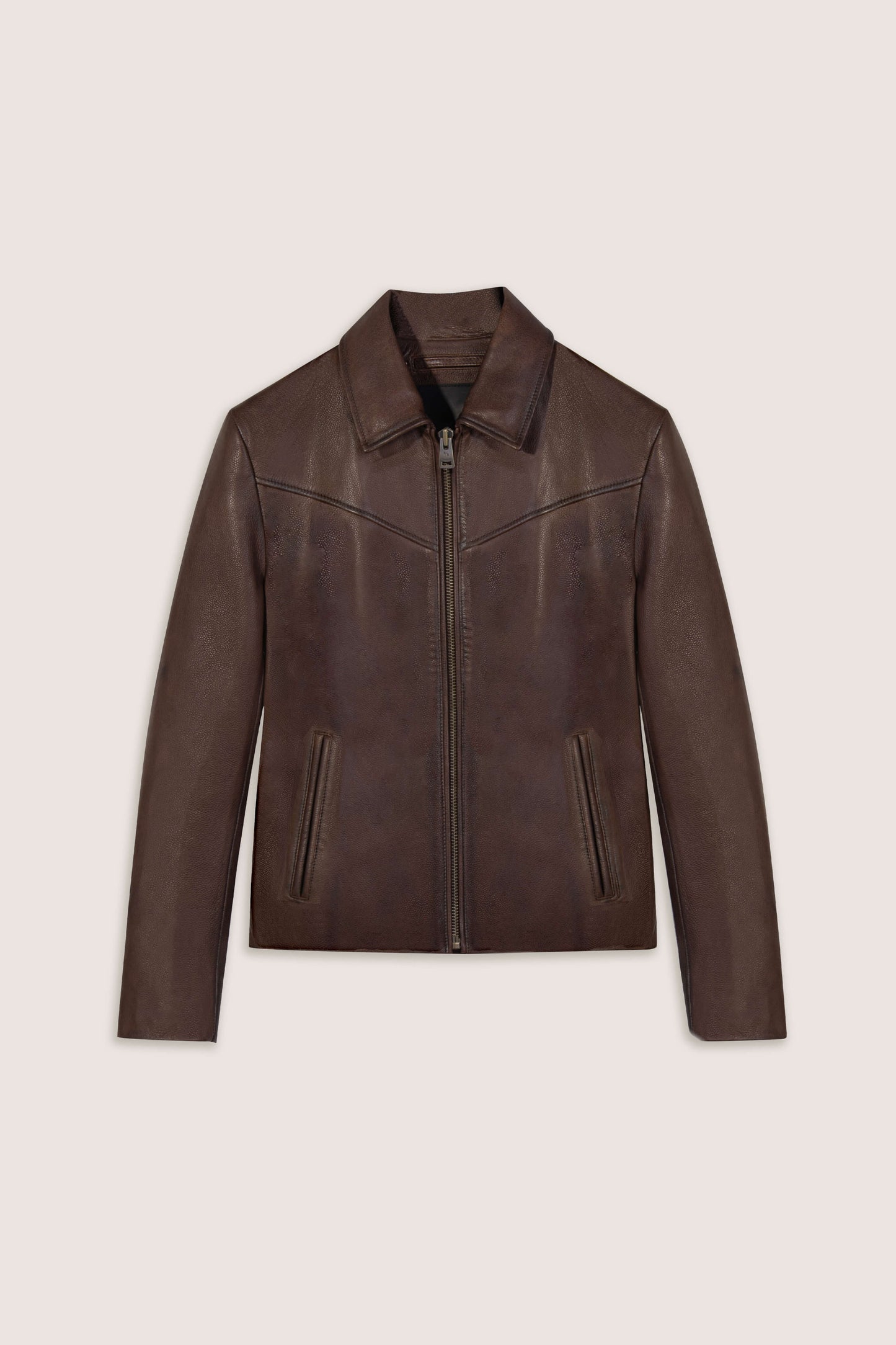 Brown leather jacket on a light beige background