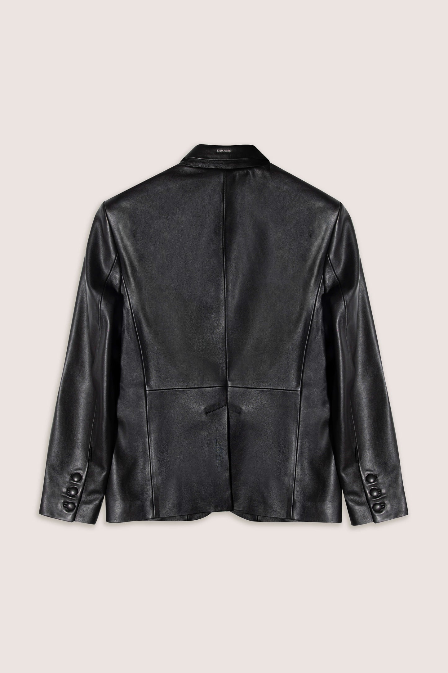 Black blazer leather jacket on a beige background